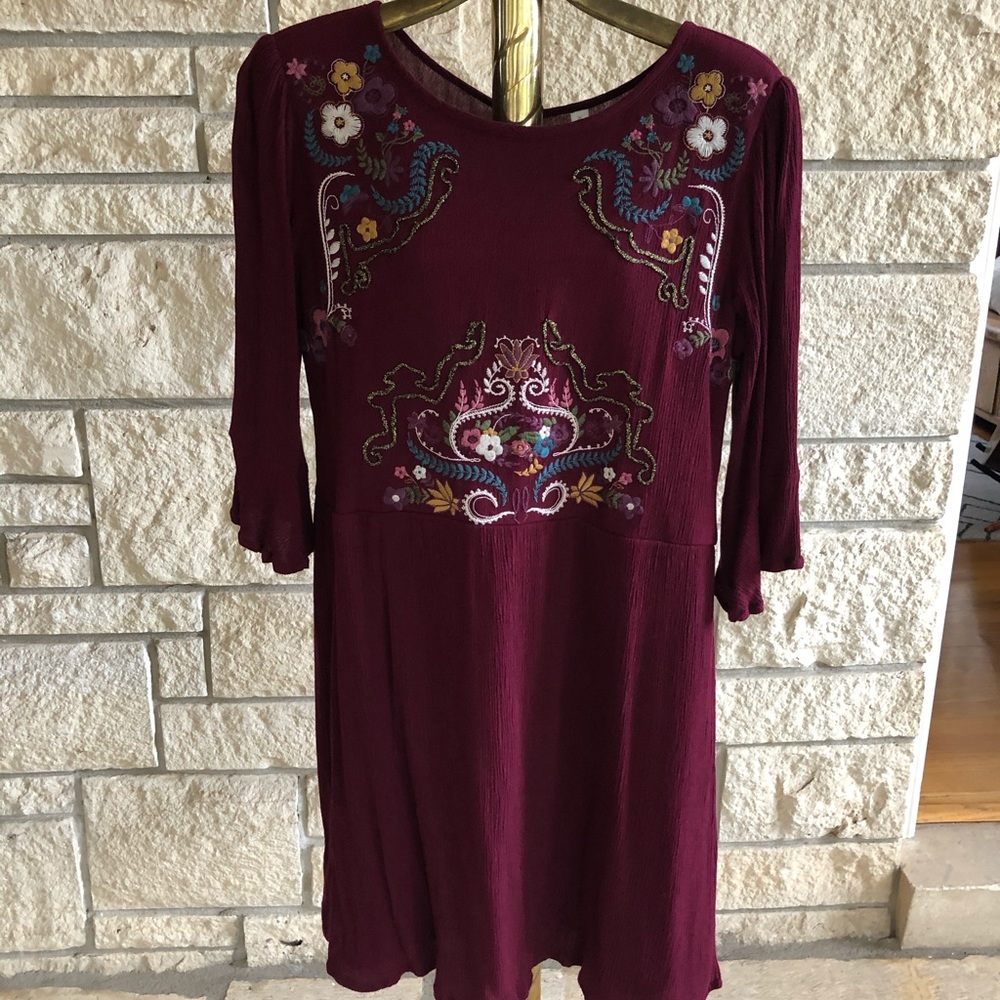 maroon dress with colorful embroidery